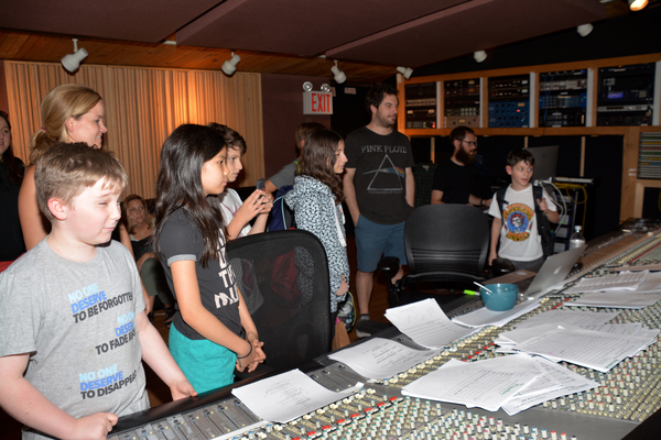 Becky Gulsvig, Justin Collette and the kids listening to the recording Photo